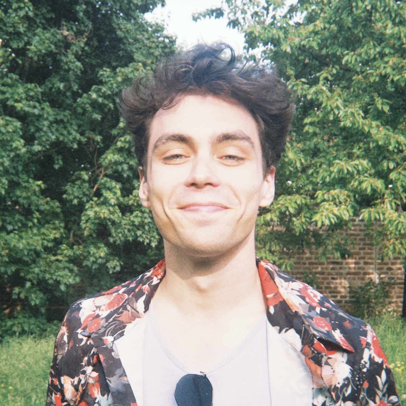 David Novák in a floral shirt, smiling